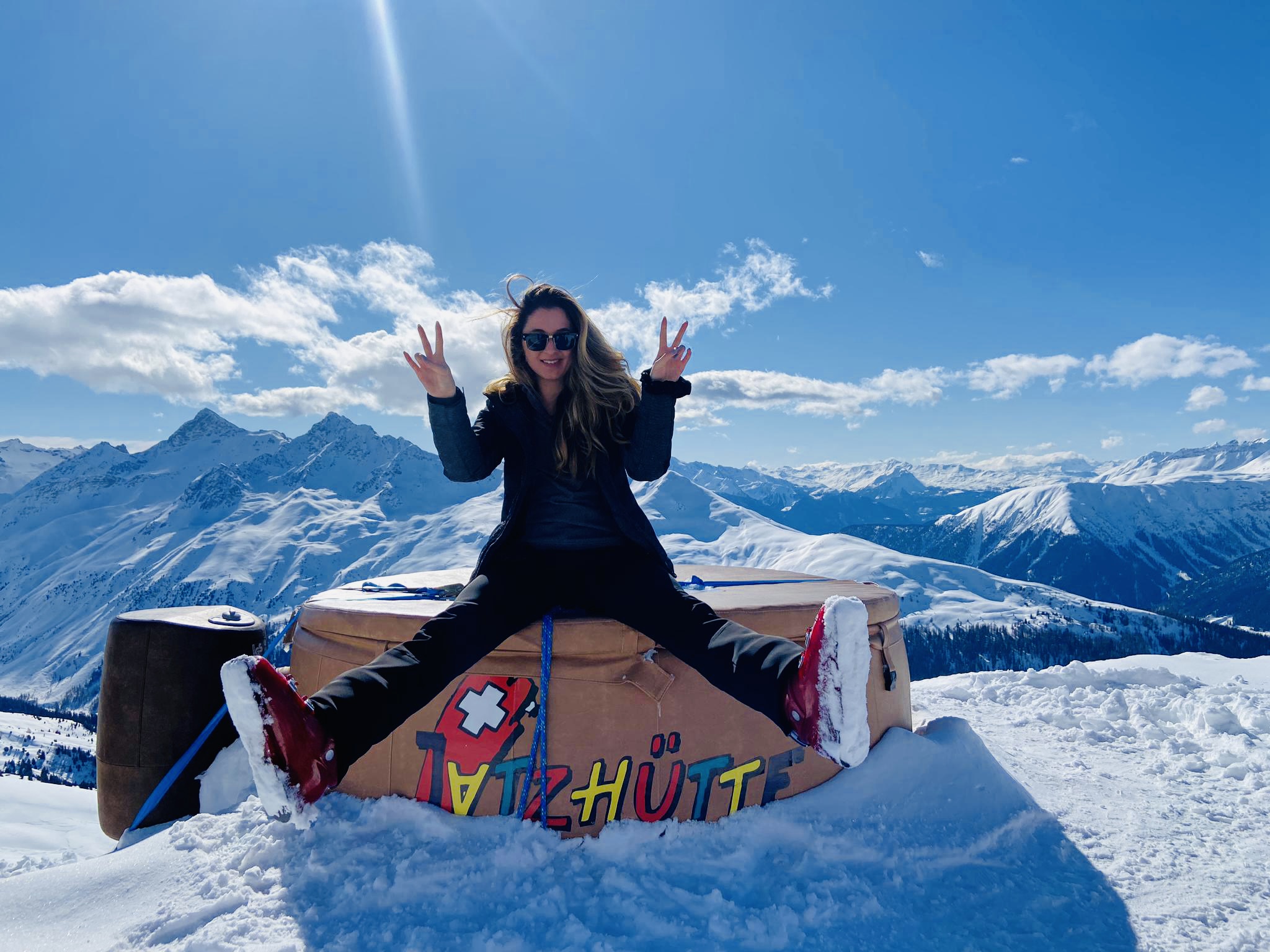 Picture with Alps in the background with a member in the foreground during the skiweekend